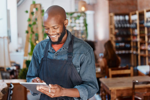 Person happily using a modern app on a tablet for business management